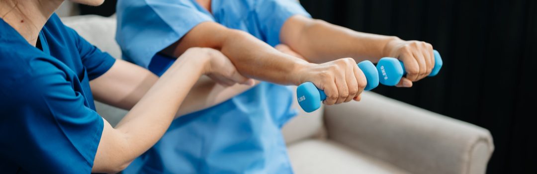 Physiotherapist helping elderly woman patient stretching arm